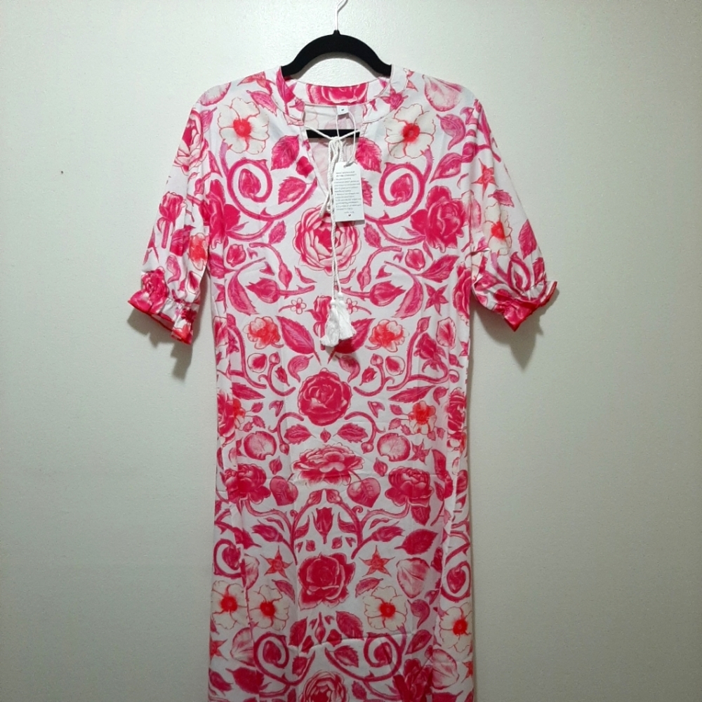 Floor length dress. White with pink flowers and white tassels